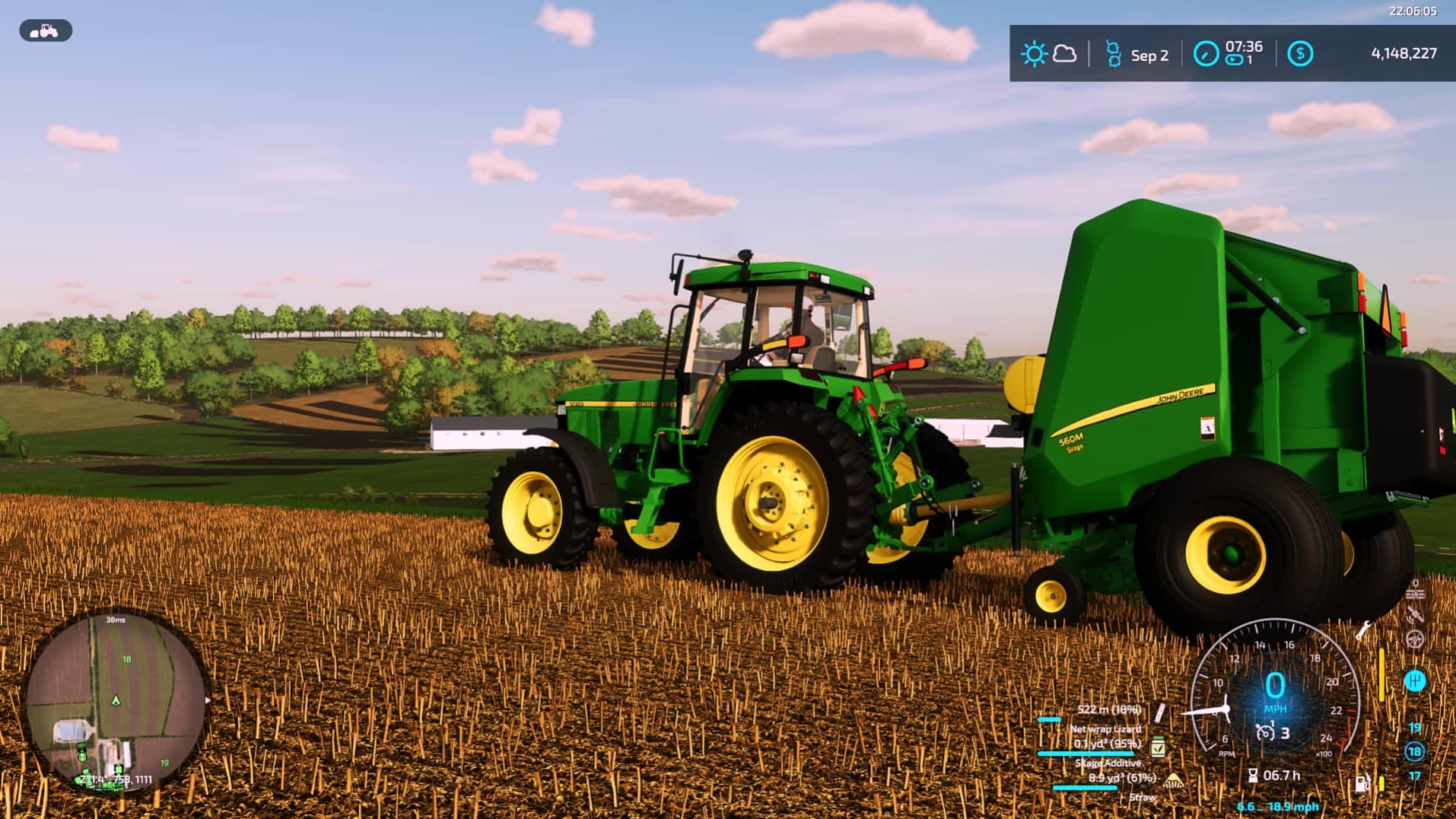 JOHN DEERE 560M WITH NET WRAP ADDON